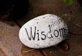 rock with Wisdom printed on it